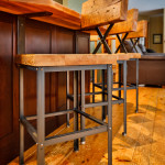barn-board-bar-stools-set-in-custom-rustic-kitchen