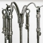 custom-hand-forged-metal-fire-tools-hanging-on-hand-made-steel-rack